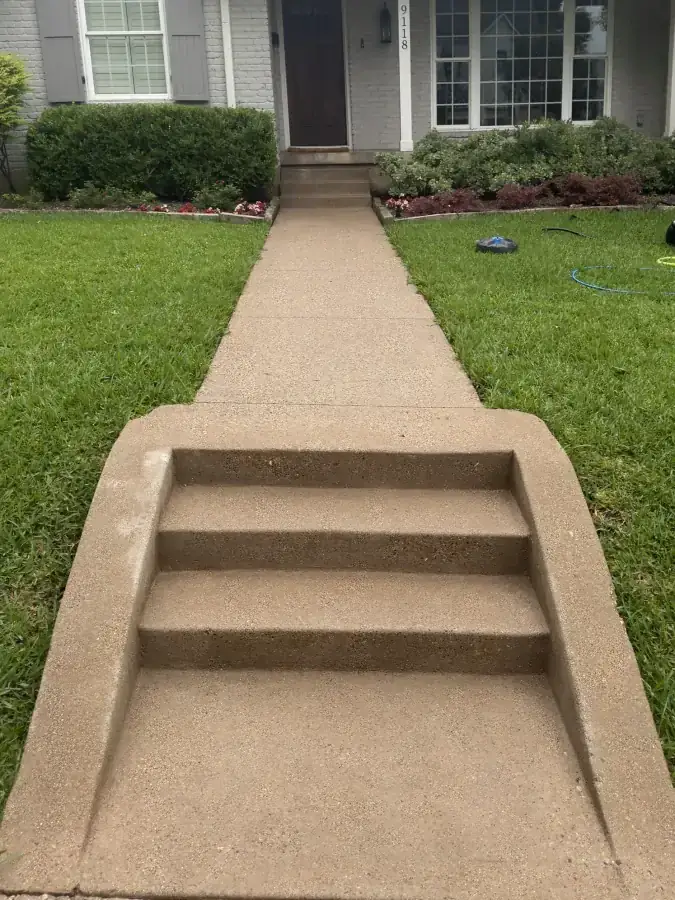 Front steps and walkway looking bright and restored after power washing in McKinney